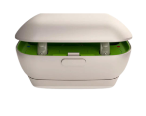 Custom in-ear hearing aids placed inside black charging case with open lid
