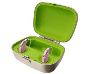 Pink behind-the-ear hearing aids inside green charging case with open lid